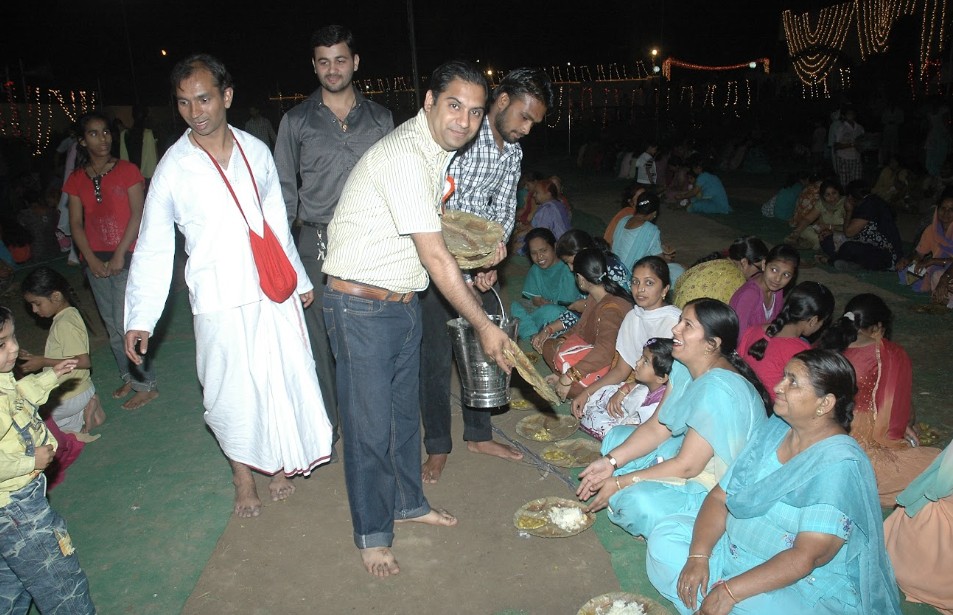 Plates of prasadam being served
