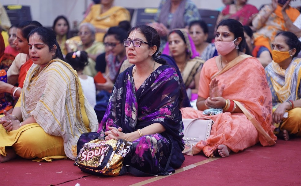 Temple lamps glowing during evening aarti